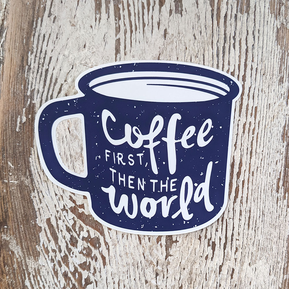 Sticker of coffee first then the world mug